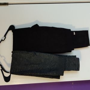 2 pair leggings. One black with floral design, one grey.